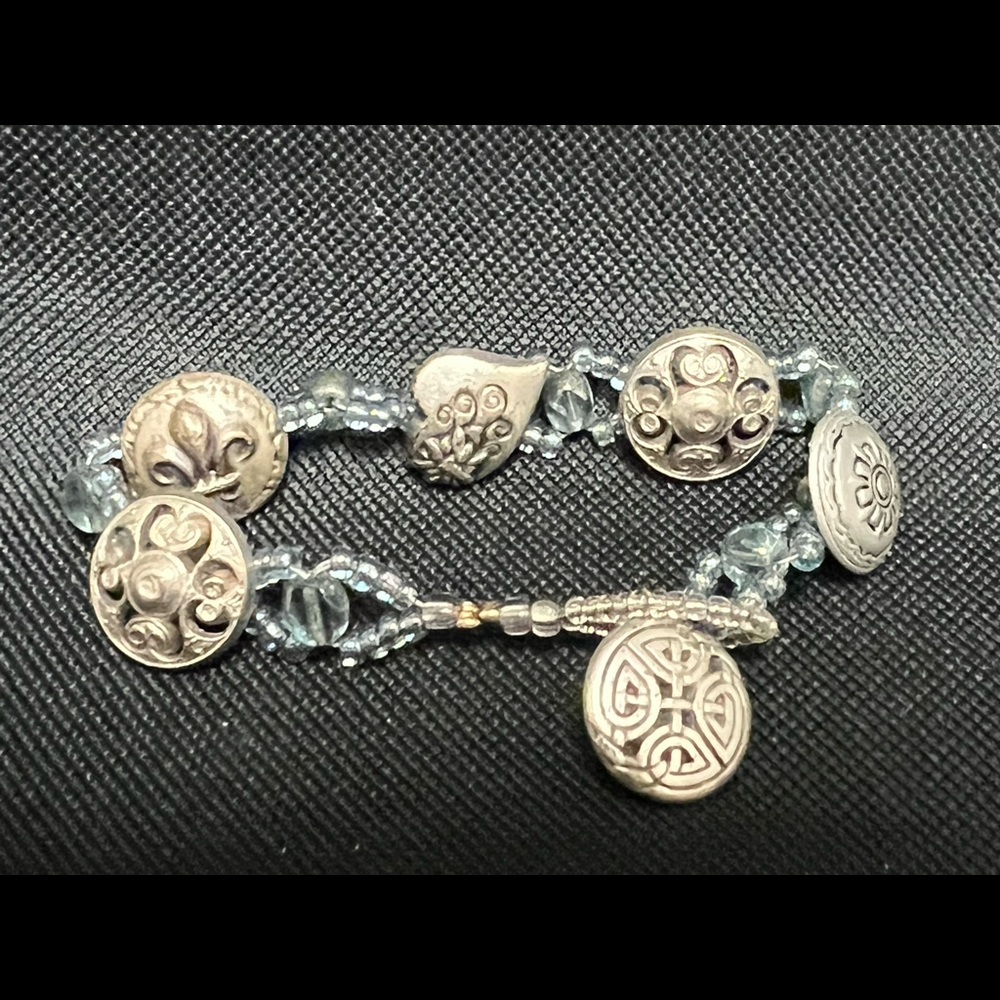 Silver-tone button bracelet. With light blue seed beads.